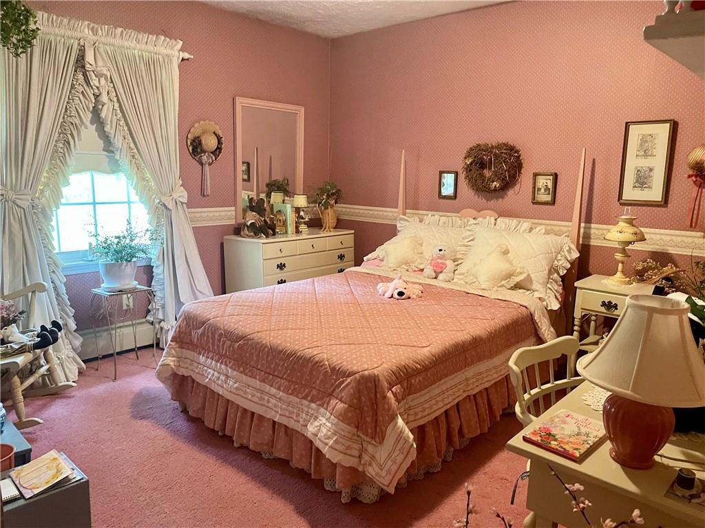 719 Zehner Road Indiana, PA 15701 - Photo 12 of 14 a bed sitting in a bedroom next to a window