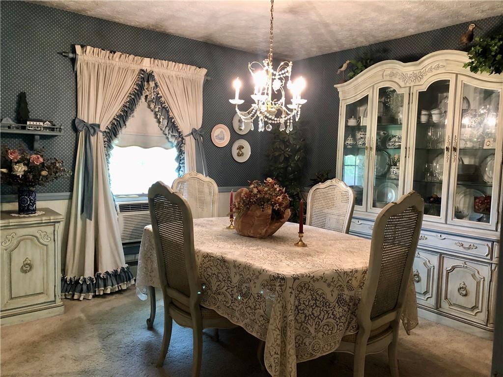 719 Zehner Road Indiana, PA 15701 - Photo 6 of 14 a dining room with furniture a chandelier and window