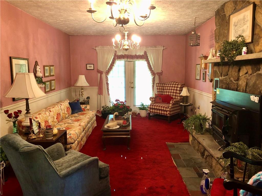 719 Zehner Road Indiana, PA 15701 - Photo 8 of 14 a living room with furniture and a chandelier