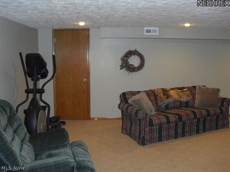 6250 Dodge Road Southwest Canton, OH 44706 - Photo 18 of 25 Very clean finished basement, it does have a full bathroom in the basement