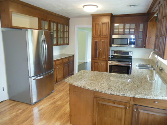 4645 Grandin Road Southwest Roanoke, VA 24018 - Photo 4 of 23 a kitchen with stainless steel appliances granite countertop a refrigerator and a stove