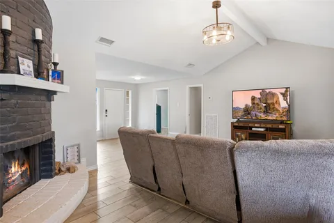 a large kitchen with stainless steel appliances kitchen island granite countertop a sink and cabinets