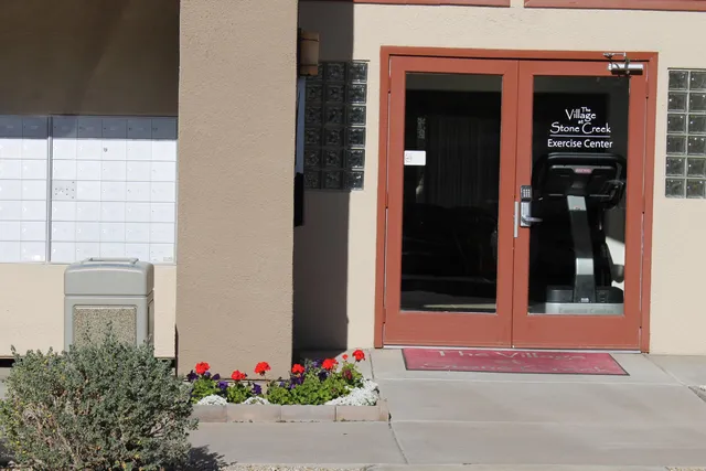 front view of a house with a potted plant