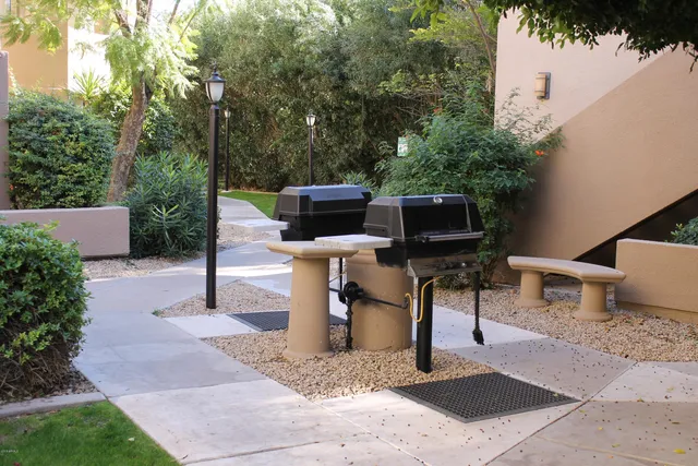 a view of a backyard with sitting area