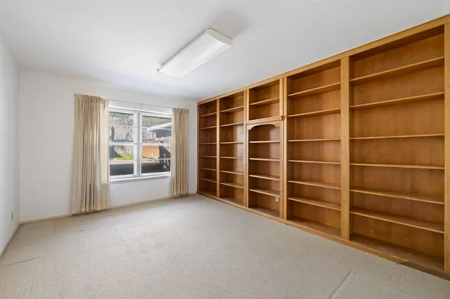 a view of an empty room with a empty shelves
