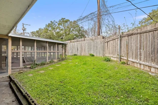 a view of a backyard with potted plants