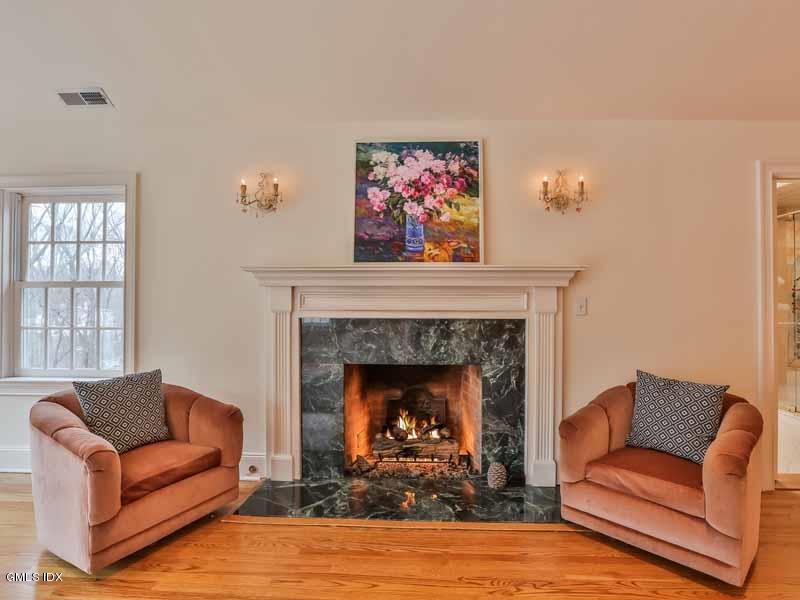 385 Middlesex Road Darien, CT 06820 - Photo 14 of 28 a living room with furniture and a fireplace