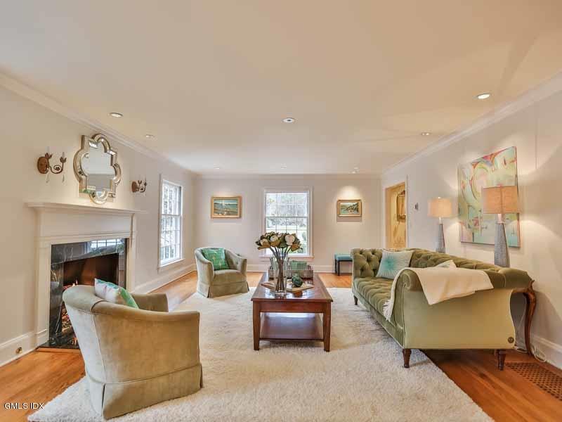 385 Middlesex Road Darien, CT 06820 - Photo 3 of 28 a living room with furniture and a fireplace
