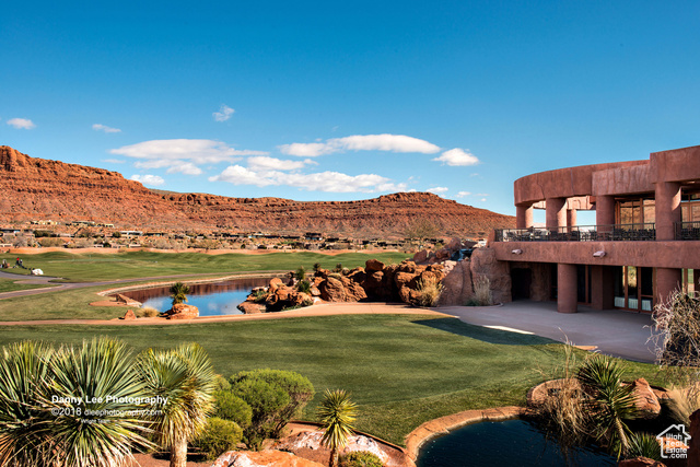 0 St. George, UT 84770 - Photo 14 of 22 View of green lawn with view of golf course, a water and mountain view, a patio, and a balcony