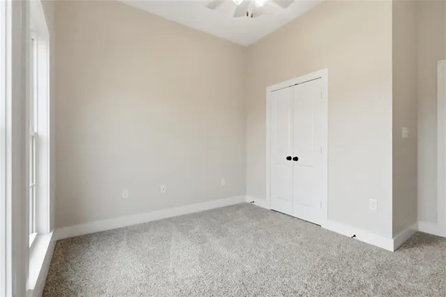a bathroom with a toilet and bathtub