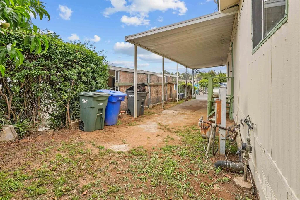 1455 Alturas Street, Unit 41 Fallbrook, CA 92028 - Photo 19 of 52 a view of a backyard space with porch