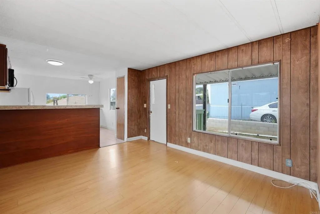 1455 Alturas Street, Unit 41 Fallbrook, CA 92028 - Photo 31 of 52 a view of a hallway with wooden shelves