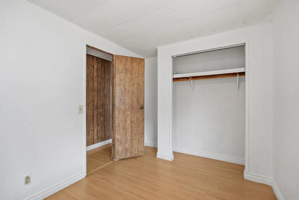 1455 Alturas Street, Unit 41 Fallbrook, CA 92028 - Photo 34 of 52 a view of an empty room with closet and a window