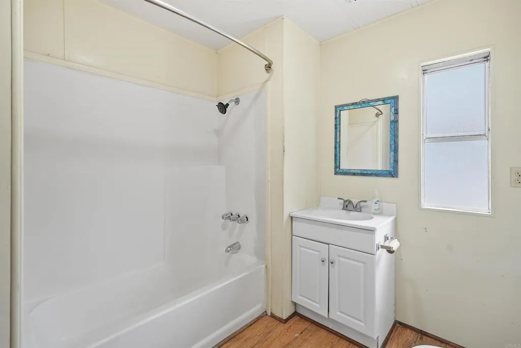 1455 Alturas Street, Unit 41 Fallbrook, CA 92028 - Photo 40 of 52 a bathroom with a bathtub a shower a sink and mirror