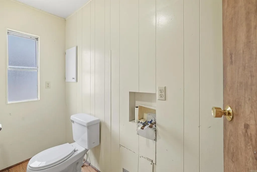 1455 Alturas Street, Unit 41 Fallbrook, CA 92028 - Photo 41 of 52 a white toilet sitting next to a bathroom sink