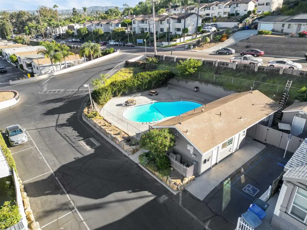 1455 Alturas Street, Unit 41 Fallbrook, CA 92028 - Photo 7 of 52 an aerial view of a house with a garden and lake view