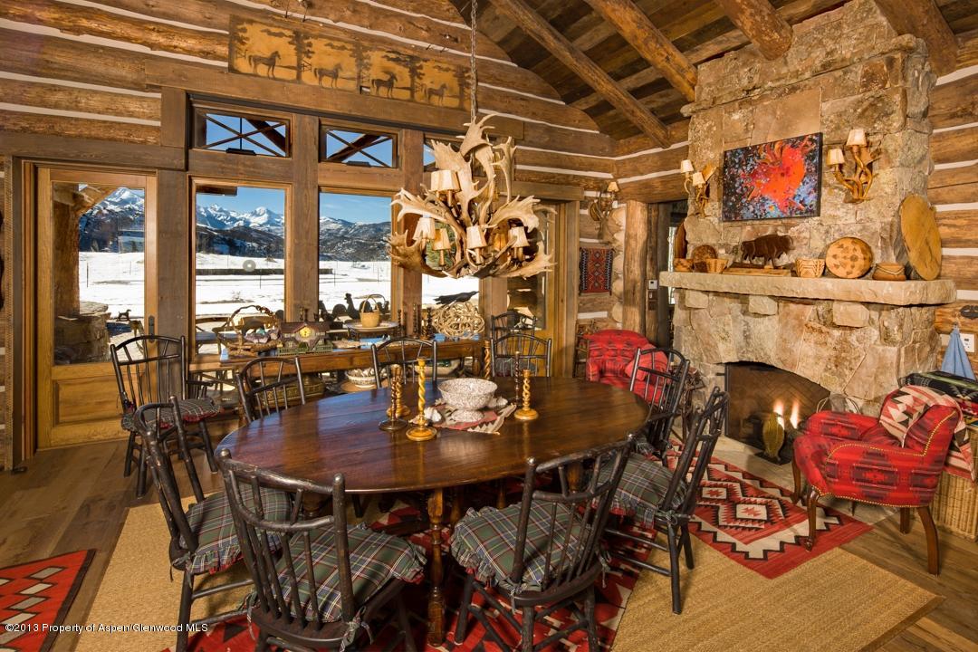 1100 McLain Flats Road Aspen, CO 81612 - Photo 13 of 50 a view of a dining room with furniture and chandelier