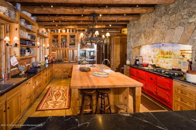 a bedroom with furniture and a flat screen tv