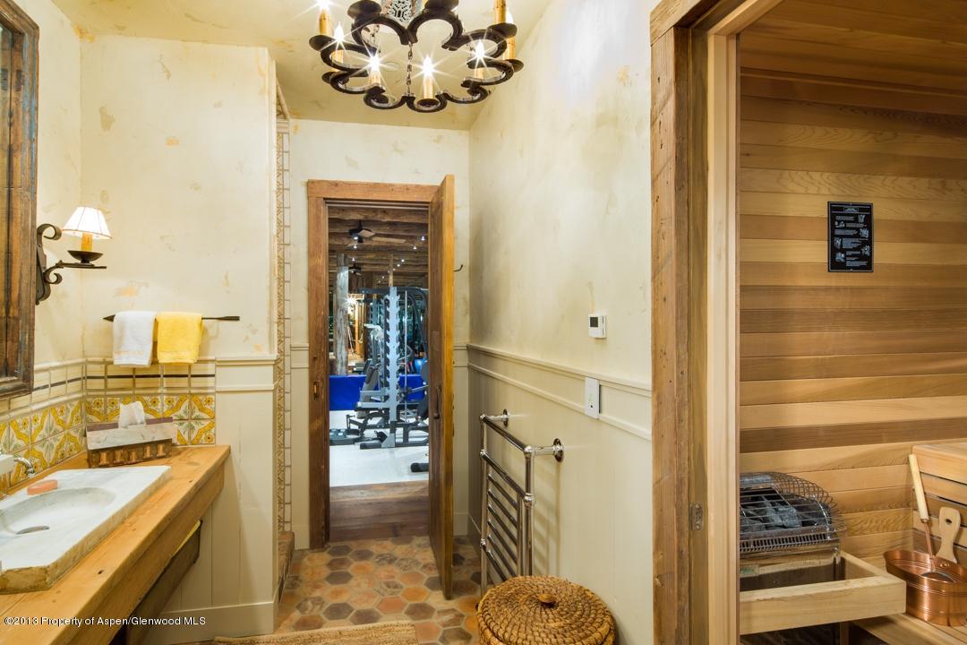 1100 McLain Flats Road Aspen, CO 81612 - Photo 23 of 50 a view of a bathroom with a sink and mirror