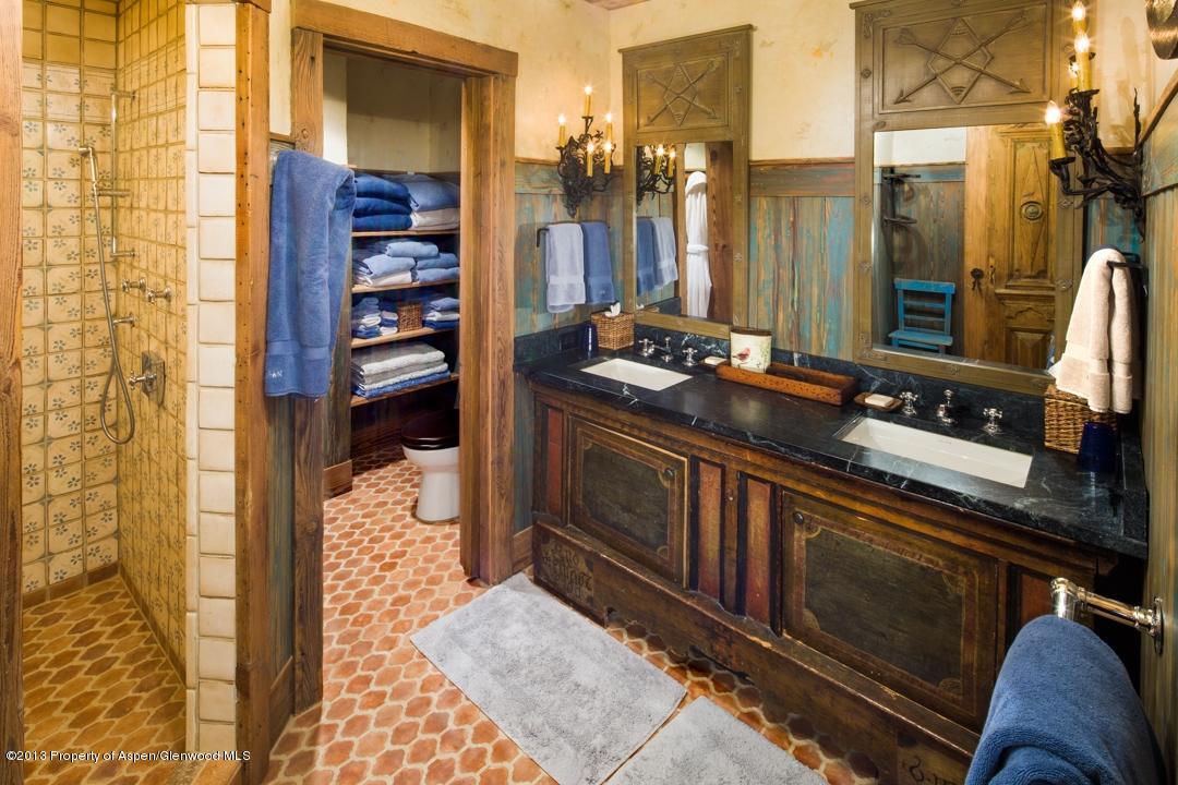 1100 McLain Flats Road Aspen, CO 81612 - Photo 26 of 50 a bathroom with a sink and a mirror