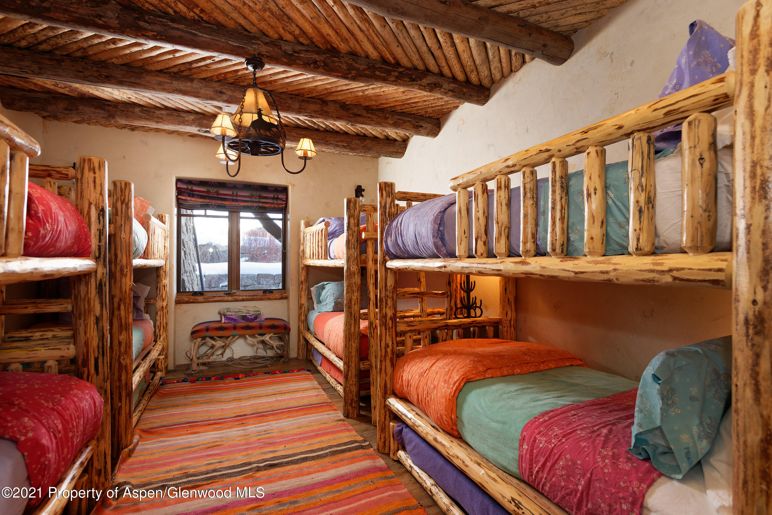 1100 McLain Flats Road Aspen, CO 81612 - Photo 27 of 50 a bedroom with two beds and a walk in closet