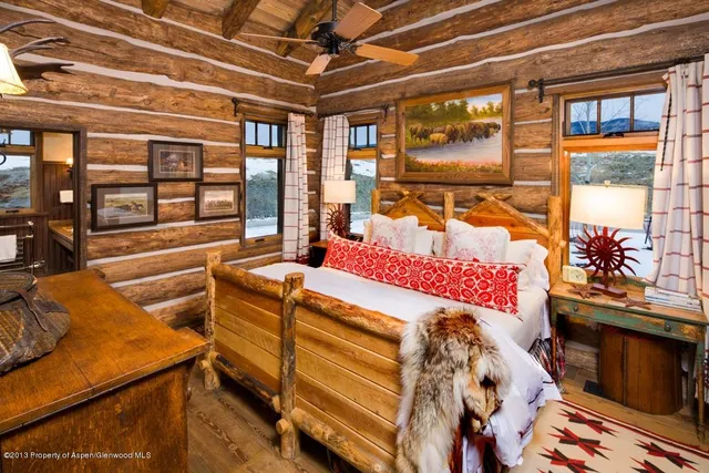 a view of a lake with houses in the back