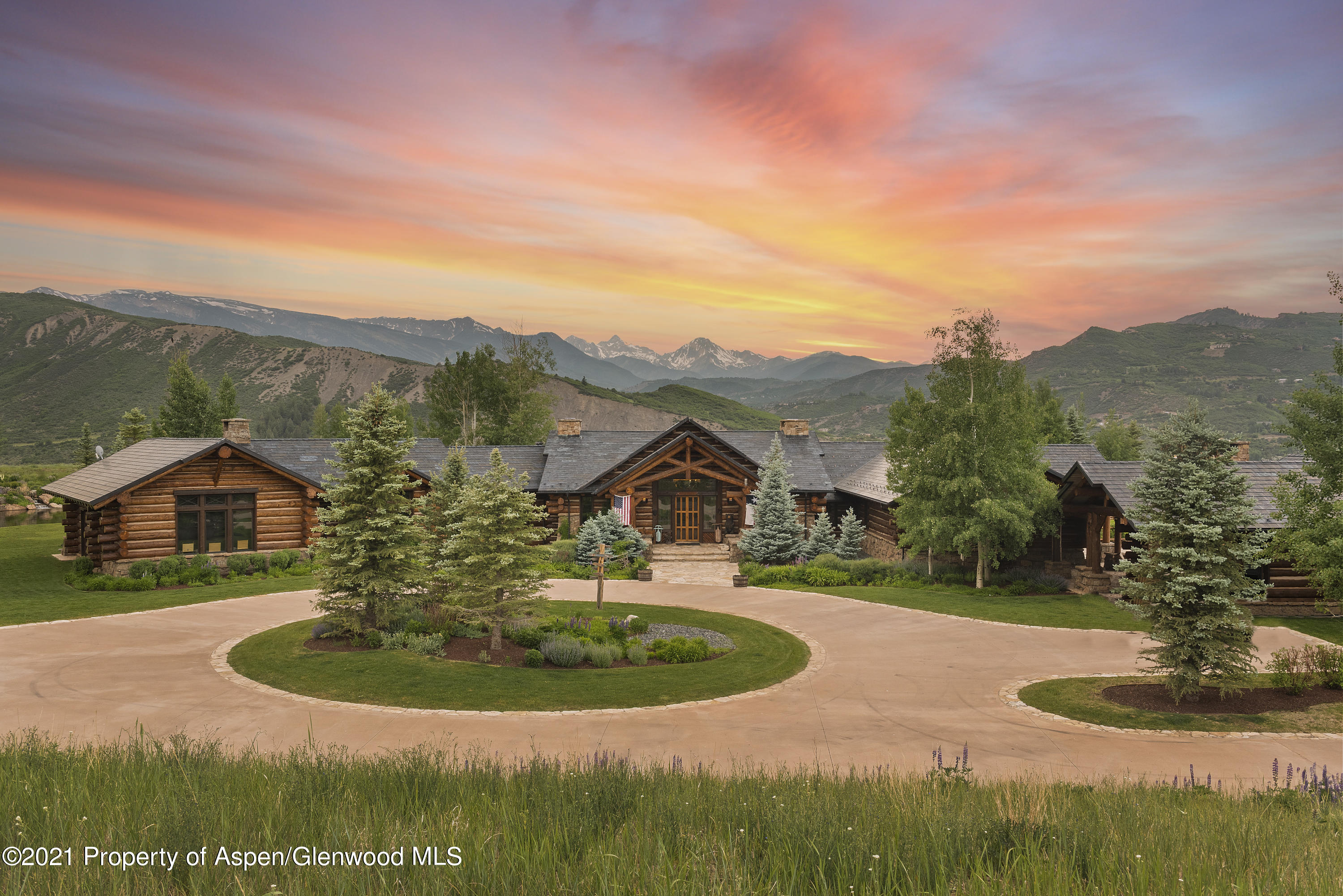 1100 McLain Flats Road Aspen, CO 81612 - Photo 41 of 50 a view of a house with a yard and potted plants