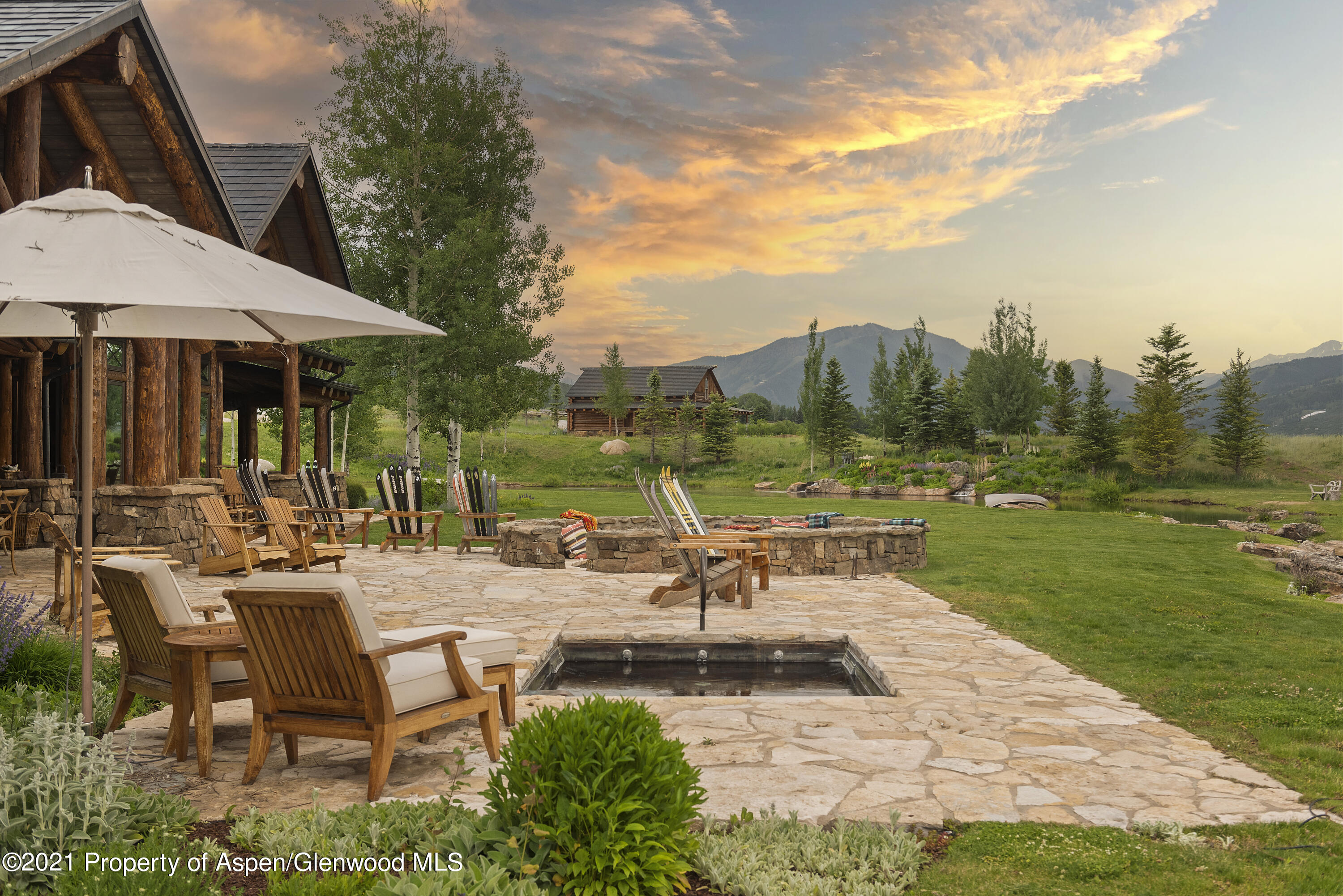 1100 McLain Flats Road Aspen, CO 81612 - Photo 42 of 50 a view of a swimming pool and lounge chairs in patio