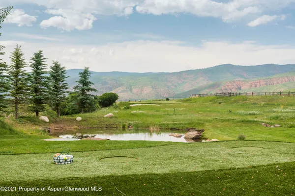 a view of a chairs and tables in patio