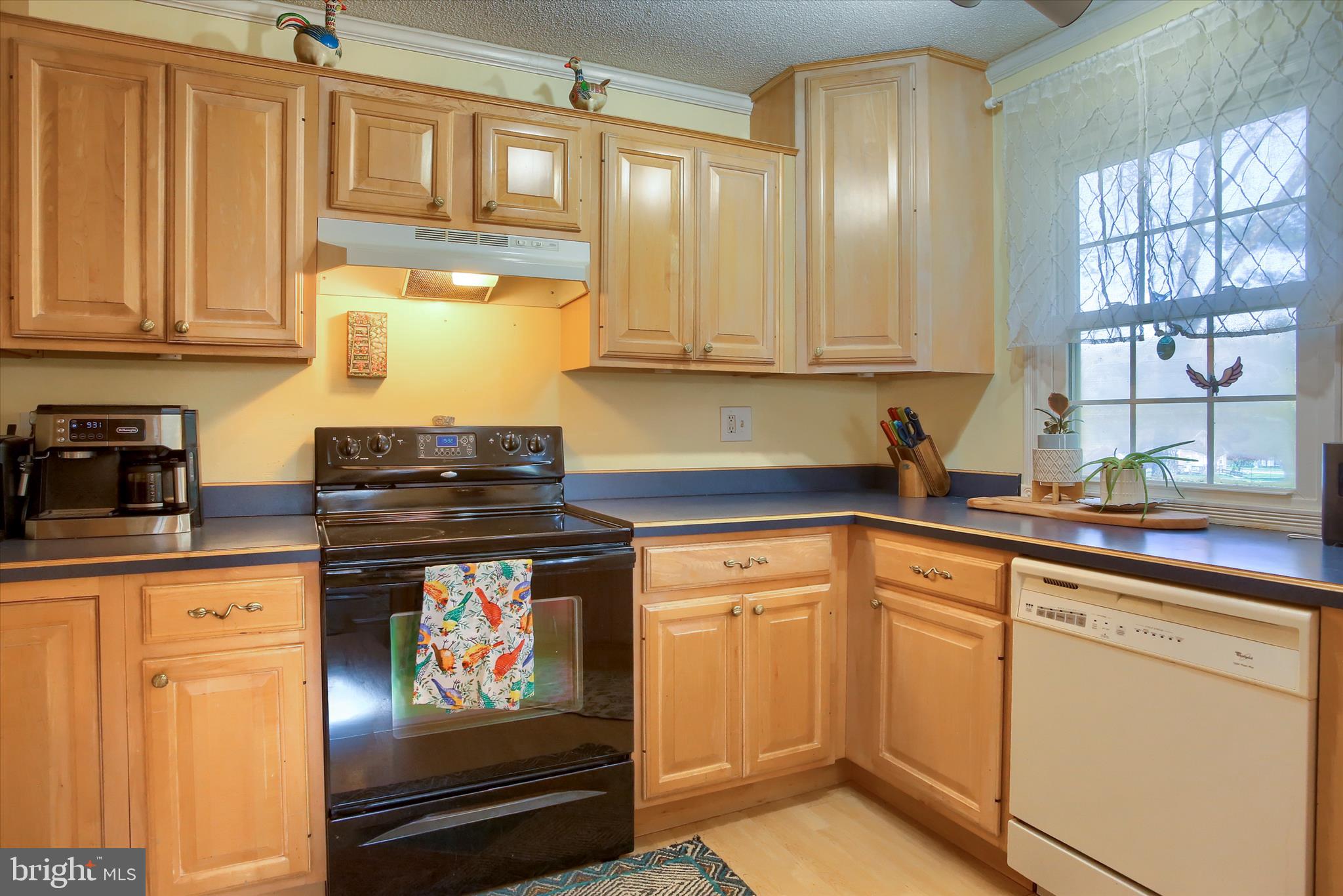 3505 Cranmere Lane York, PA 17402 - Photo 12 of 33 a kitchen with stainless steel appliances granite countertop a stove a sink and a microwave