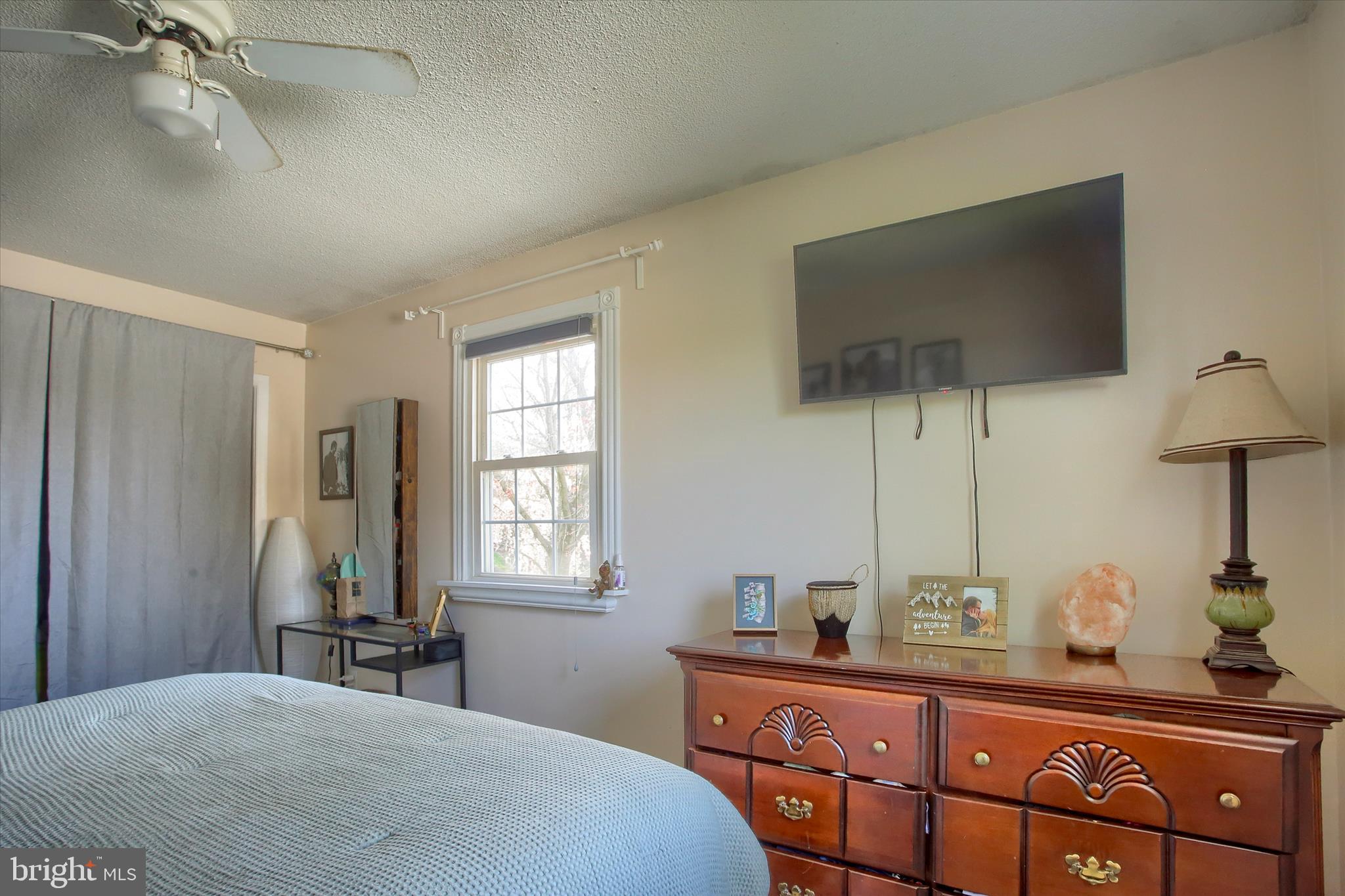 3505 Cranmere Lane York, PA 17402 - Photo 19 of 33 a bedroom with a bed and a flat tv screen on dresser