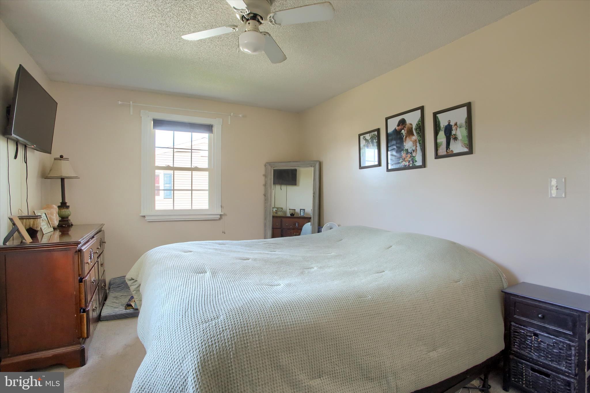 3505 Cranmere Lane York, PA 17402 - Photo 20 of 33 a bedroom with a bed and a flat screen tv