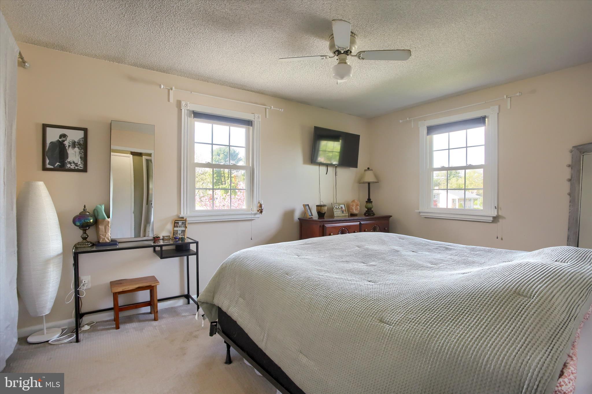 3505 Cranmere Lane York, PA 17402 - Photo 21 of 33 a bedroom with a bed a table and chair