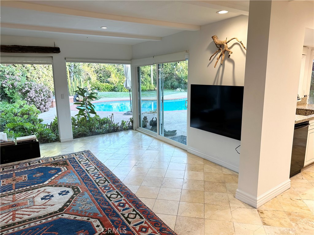 27424 Rainbow Ridge Road Palos Verdes Peninsula, CA 90274 - Photo 11 of 47 a living room with furniture and a flat screen tv