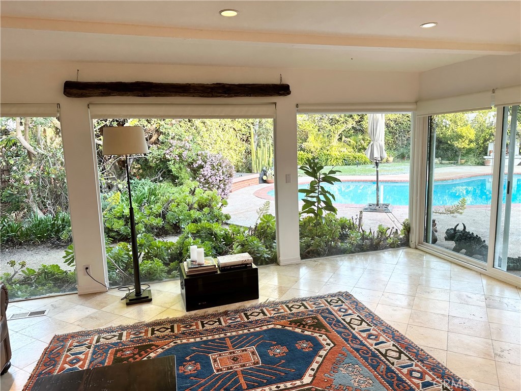 27424 Rainbow Ridge Road Palos Verdes Peninsula, CA 90274 - Photo 12 of 47 a living room with furniture and a large window