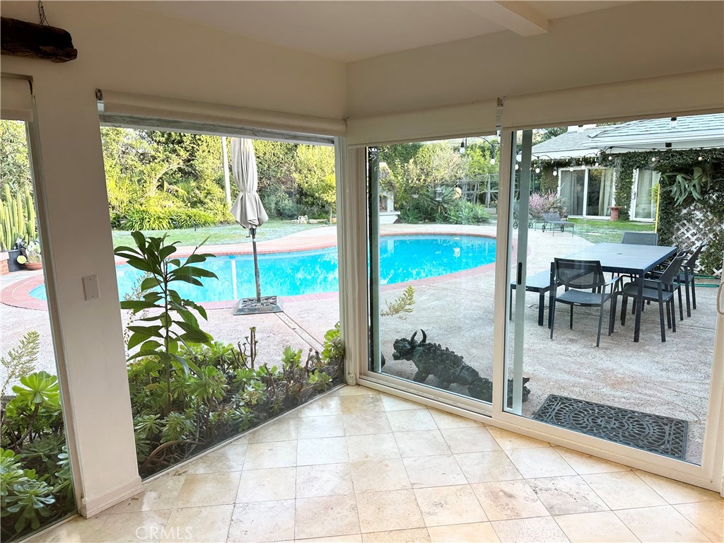 27424 Rainbow Ridge Road Palos Verdes Peninsula, CA 90274 - Photo 13 of 47 a view of a porch with chairs and backyard