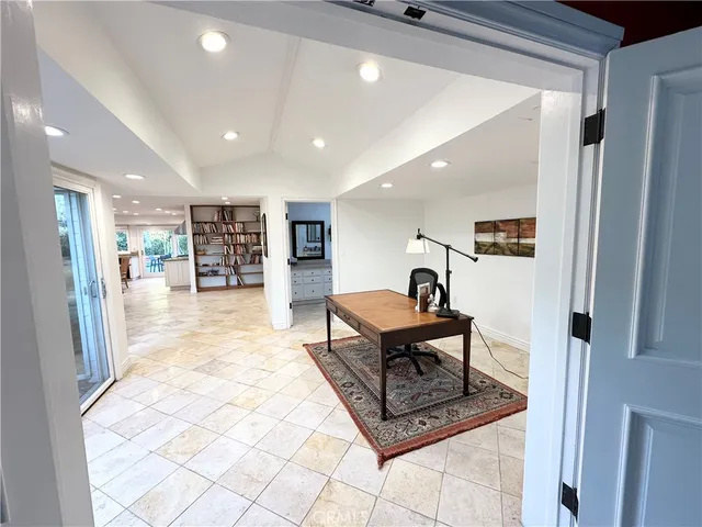 a lobby with furniture and a rug