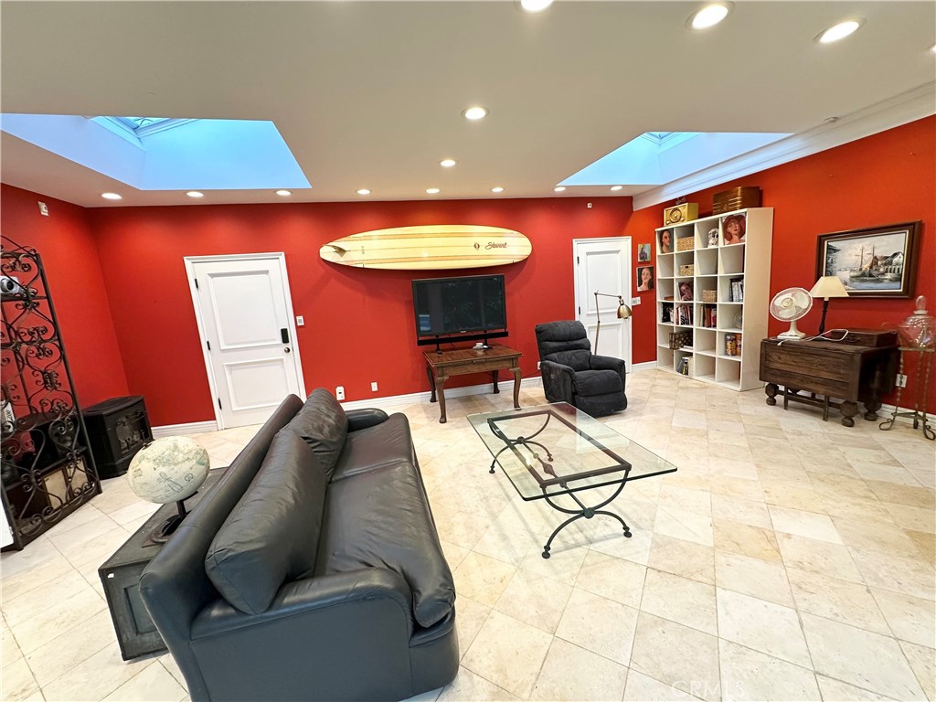 27424 Rainbow Ridge Road Palos Verdes Peninsula, CA 90274 - Photo 17 of 47 a living room with furniture and a chandelier