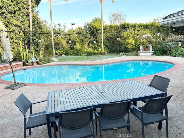 a view of a table and chairs in patio