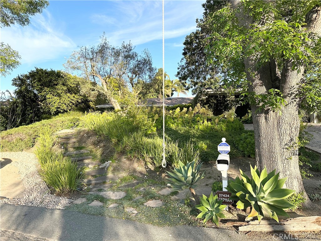27424 Rainbow Ridge Road Palos Verdes Peninsula, CA 90274 - Photo 2 of 47 a view of a yard with plants
