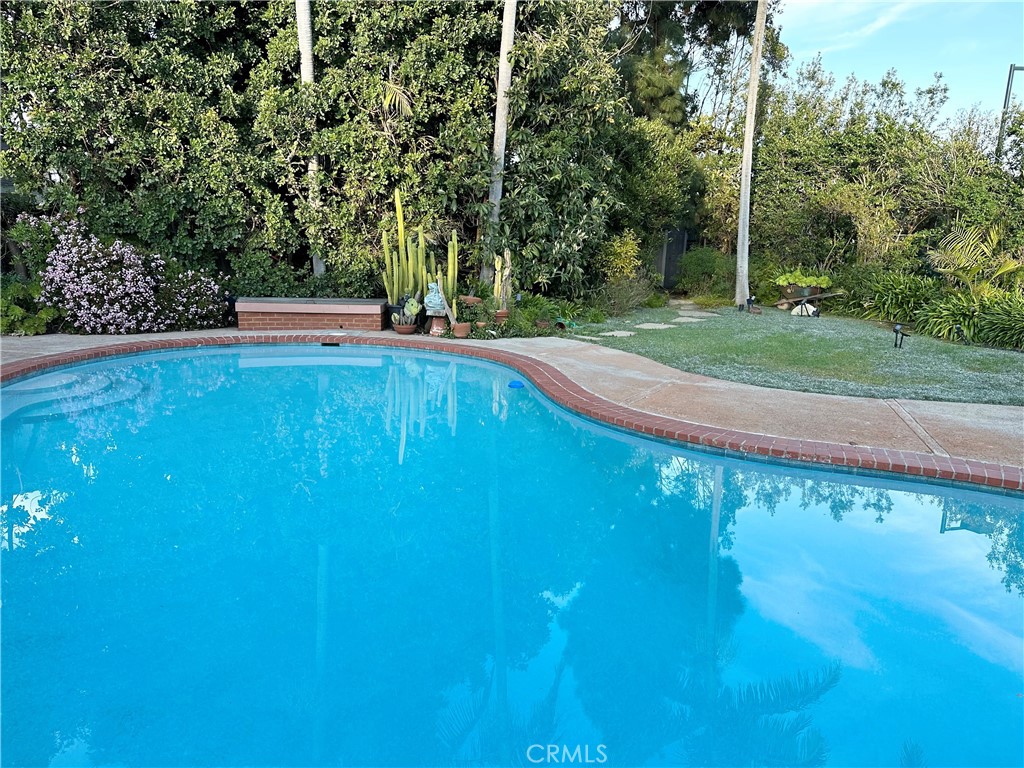 27424 Rainbow Ridge Road Palos Verdes Peninsula, CA 90274 - Photo 21 of 47 a view of a swimming pool with a yard