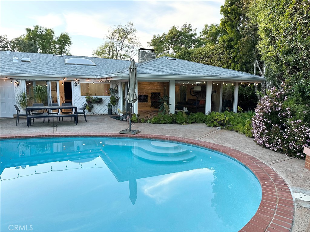 27424 Rainbow Ridge Road Palos Verdes Peninsula, CA 90274 - Photo 24 of 47 a view of a house with swimming pool and sitting area