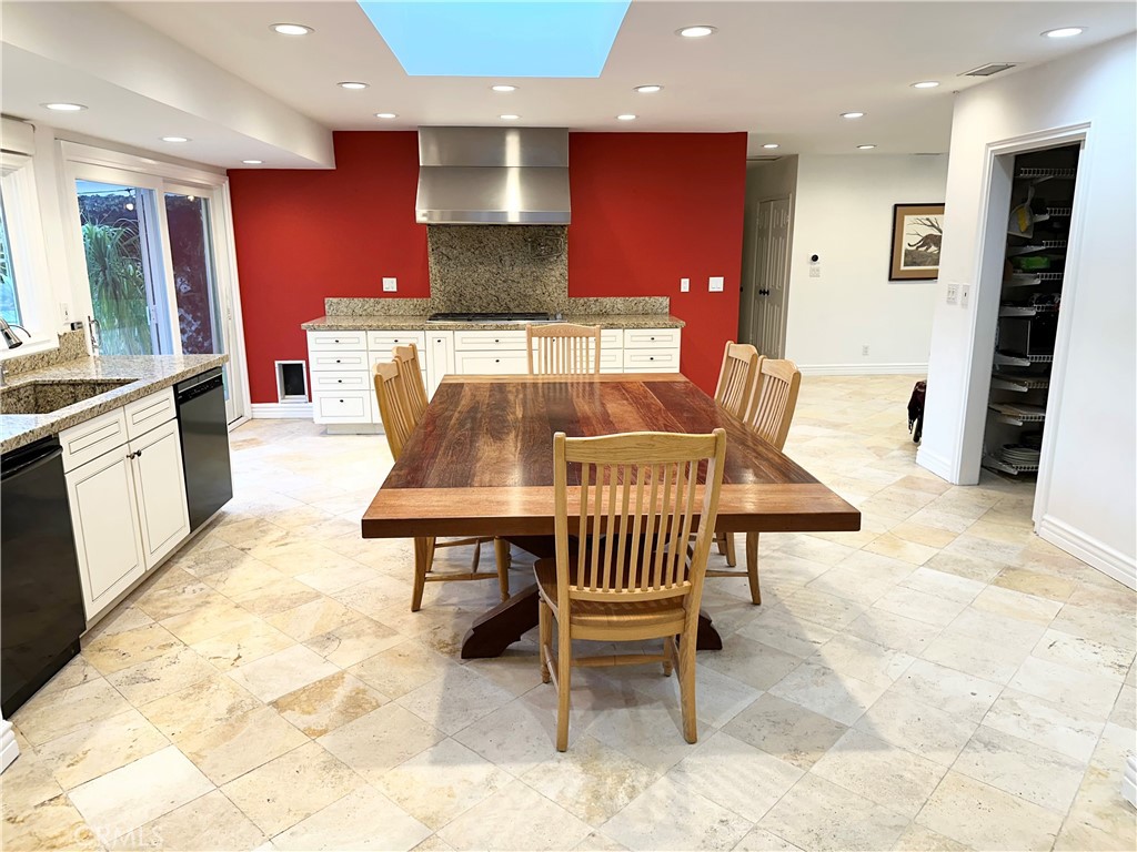 27424 Rainbow Ridge Road Palos Verdes Peninsula, CA 90274 - Photo 25 of 47 a kitchen with stainless steel appliances kitchen island granite countertop furniture and a wooden table