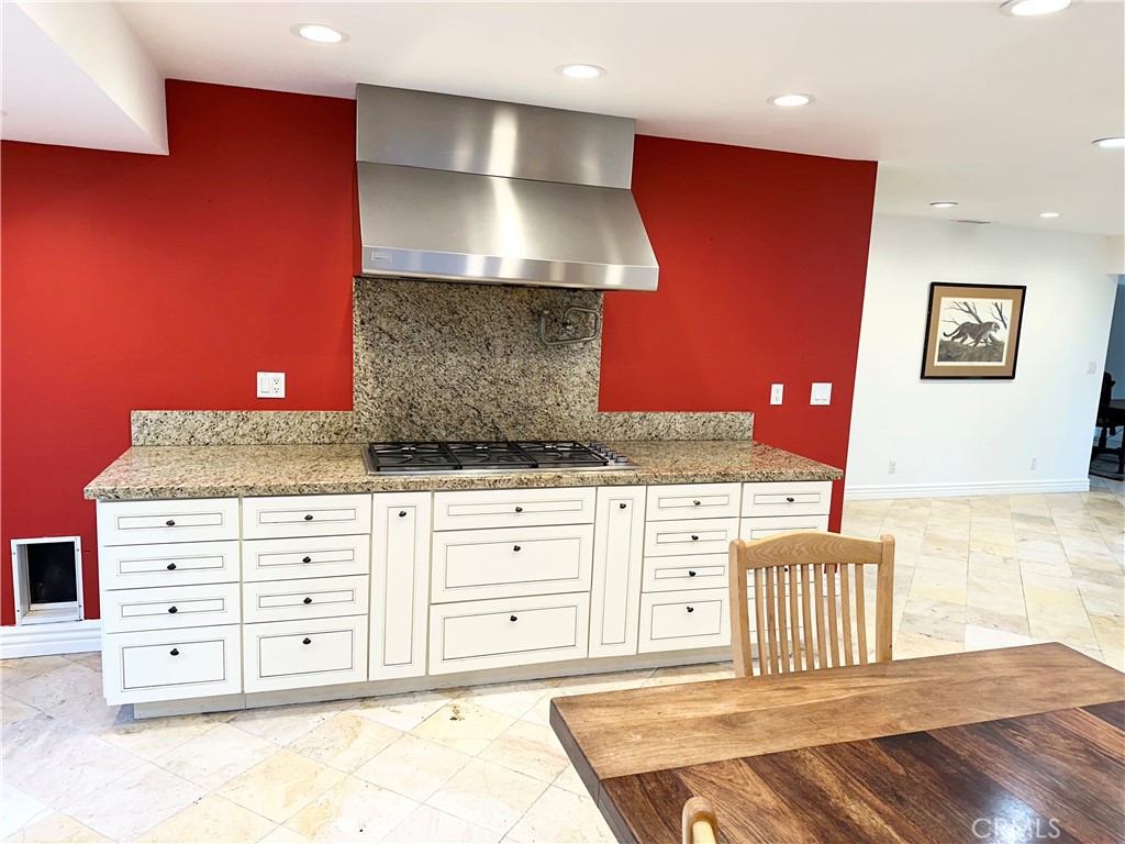 27424 Rainbow Ridge Road Palos Verdes Peninsula, CA 90274 - Photo 28 of 47 a spacious bedroom with a bed and a dresser with wooden floor