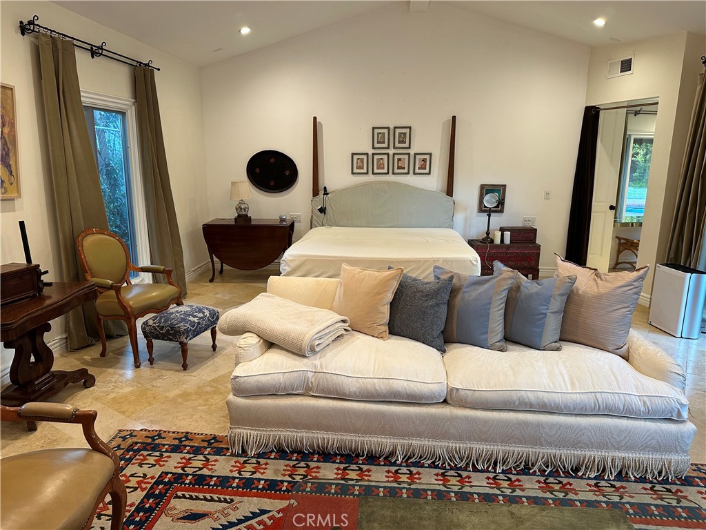 27424 Rainbow Ridge Road Palos Verdes Peninsula, CA 90274 - Photo 31 of 47 a bedroom with a bed and mirror