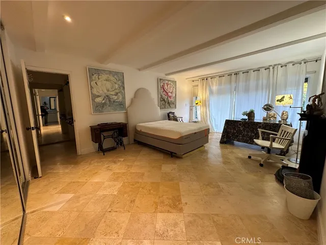 a bedroom with a bed and furniture