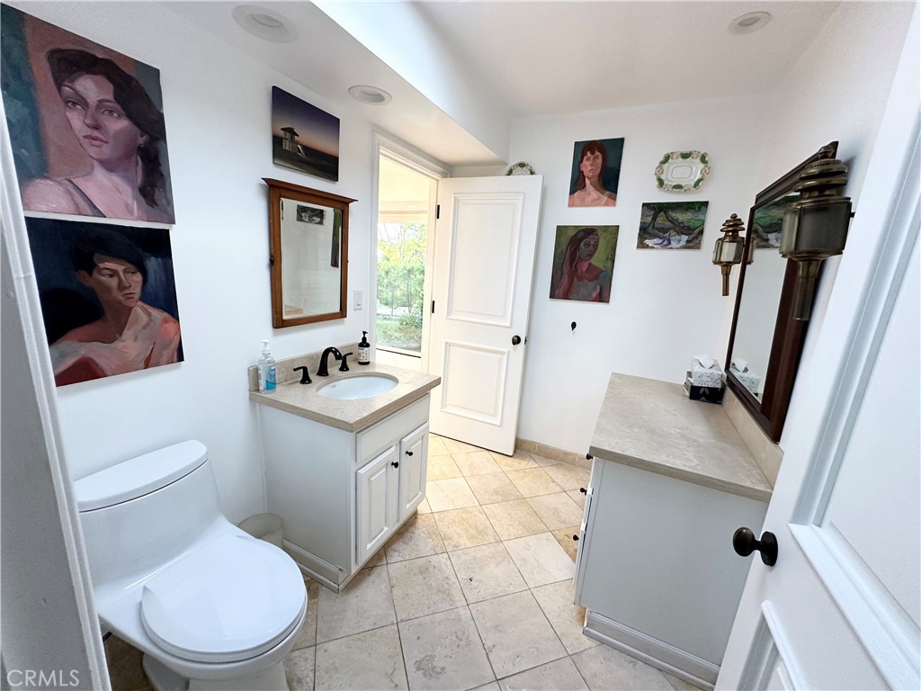 27424 Rainbow Ridge Road Palos Verdes Peninsula, CA 90274 - Photo 45 of 47 a bathroom with a toilet sink and mirror