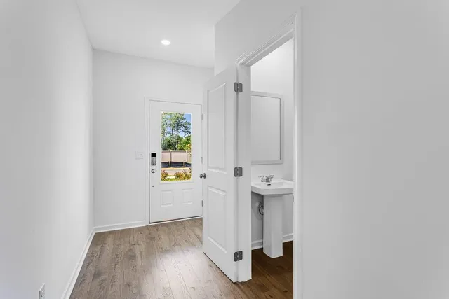 a view of an empty room and a sink