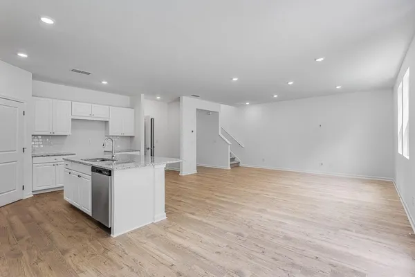 a kitchen with stainless steel appliances granite countertop a stove and a sink
