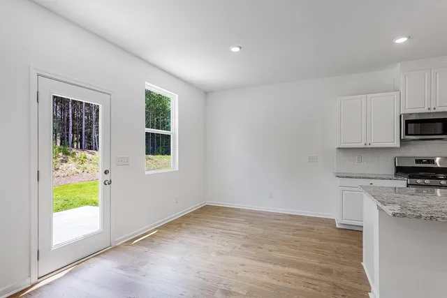 a view of a kitchen with a sink and a window